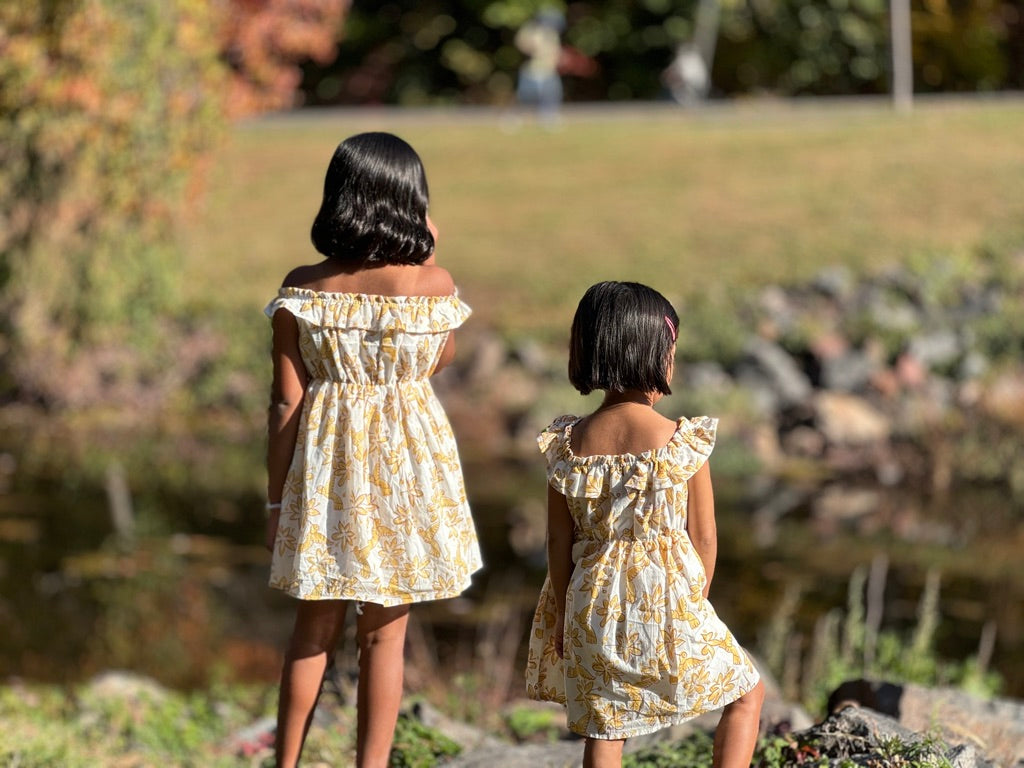 two sisters twinning in floral bird summer cotton dress