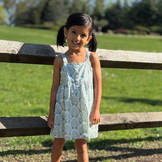 Girl wearing comfy cotton dress with leaf block print