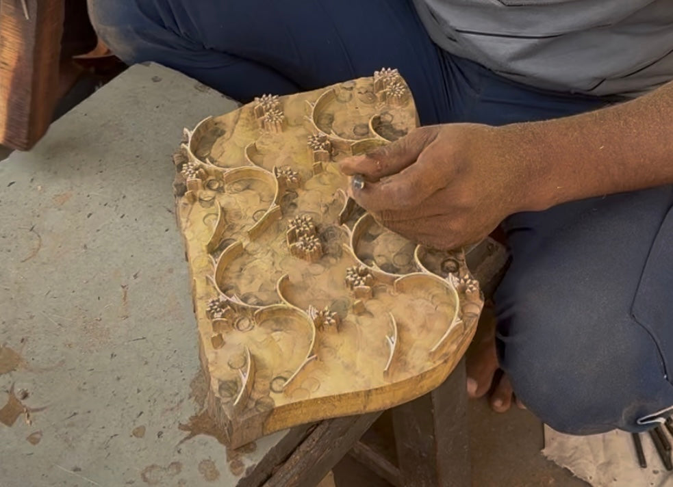 Artisans carving the wooden block piece by hands