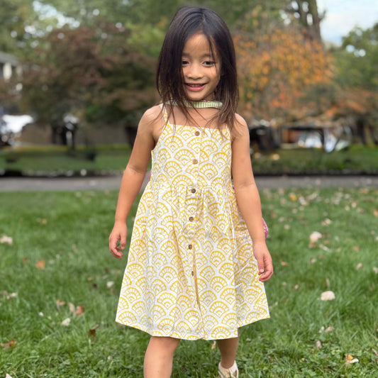 girl in yellow strap cotton summer dress 