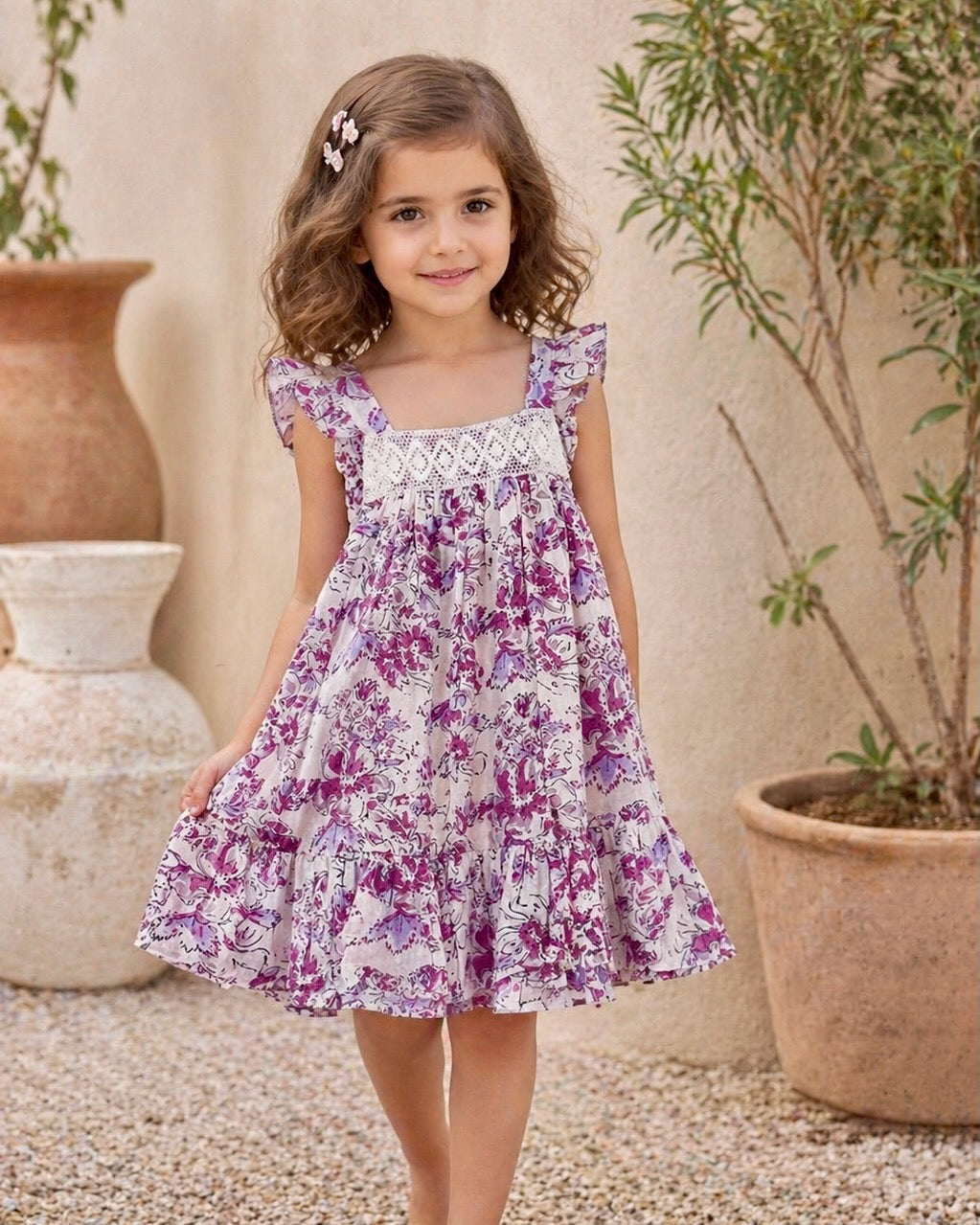 Young girl wearing lavender floral cotton summer dress enjoying outdoor play lightweight breathable outfit for warm weather