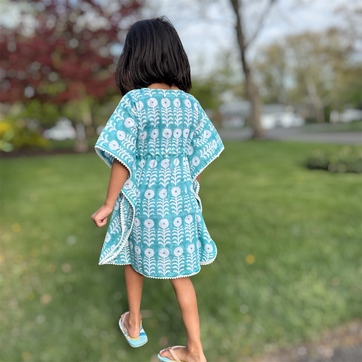 Back view of girls cotton beach cover up kaftan with block print lightweight breathable vacation outfit