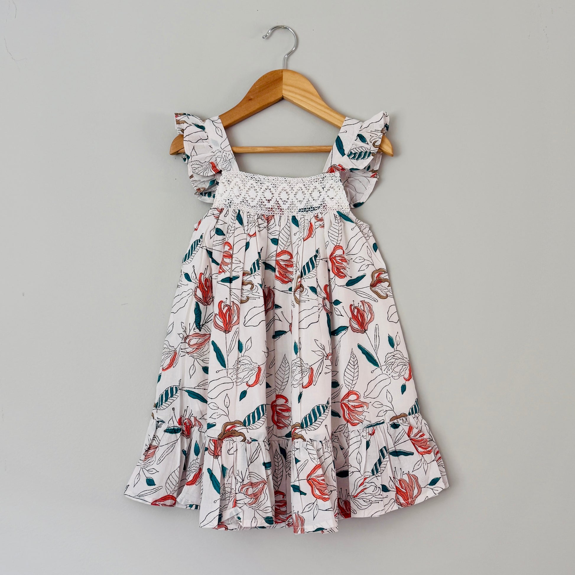 Girls coral floral cotton dress with crochet lace yoke and ruffle sleeves front view breathable summer outfit