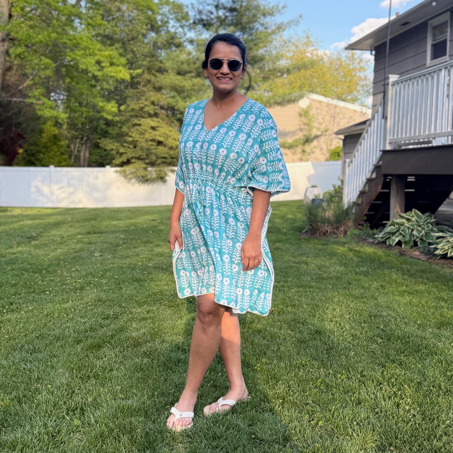 Woman wearing cotton beach cover up kaftan enjoying summer vacation lightweight breathable resort wear outfit