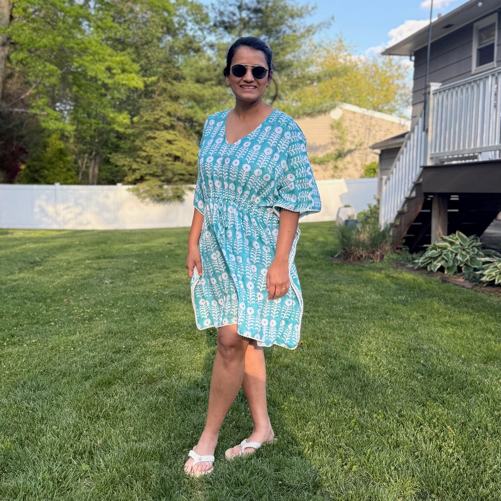 Woman wearing cotton beach cover up kaftan enjoying summer vacation lightweight breathable resort wear outfit